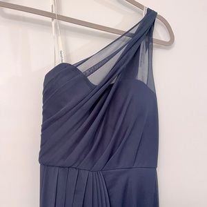 Navy one shoulder bridesmaid dress.